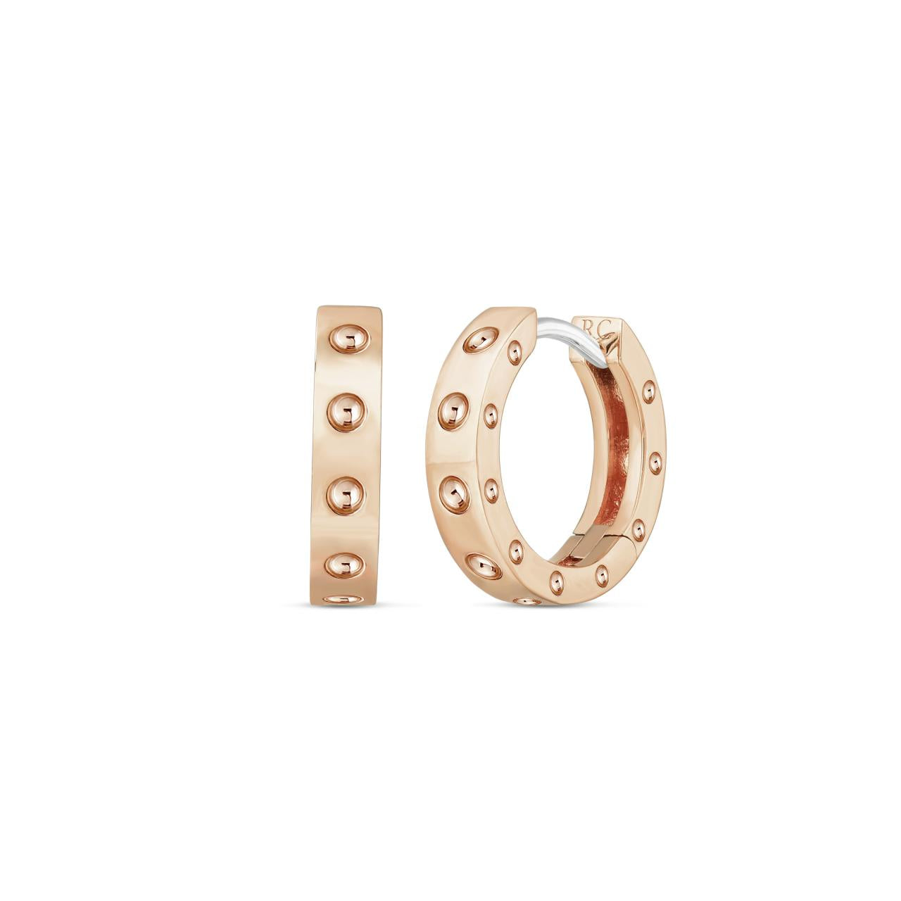 Roberto Coin Pois Moi 18ct rose gold diamond huggie earrings with polished dimple design and hidden rubies.
