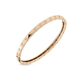 Roberto Coin Pois Moi 18ct rose gold diamond bangle with polished dimple pattern and signature hidden ruby set inside.