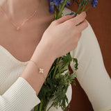 Roberto Coin Princess Flower rose and white gold diamond bracelet with flower motif and ruby clasp.