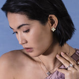 Roberto Coin Princess Flower 18ct rose and white gold diamond stud earrings featuring rope detail and hidden rubies.