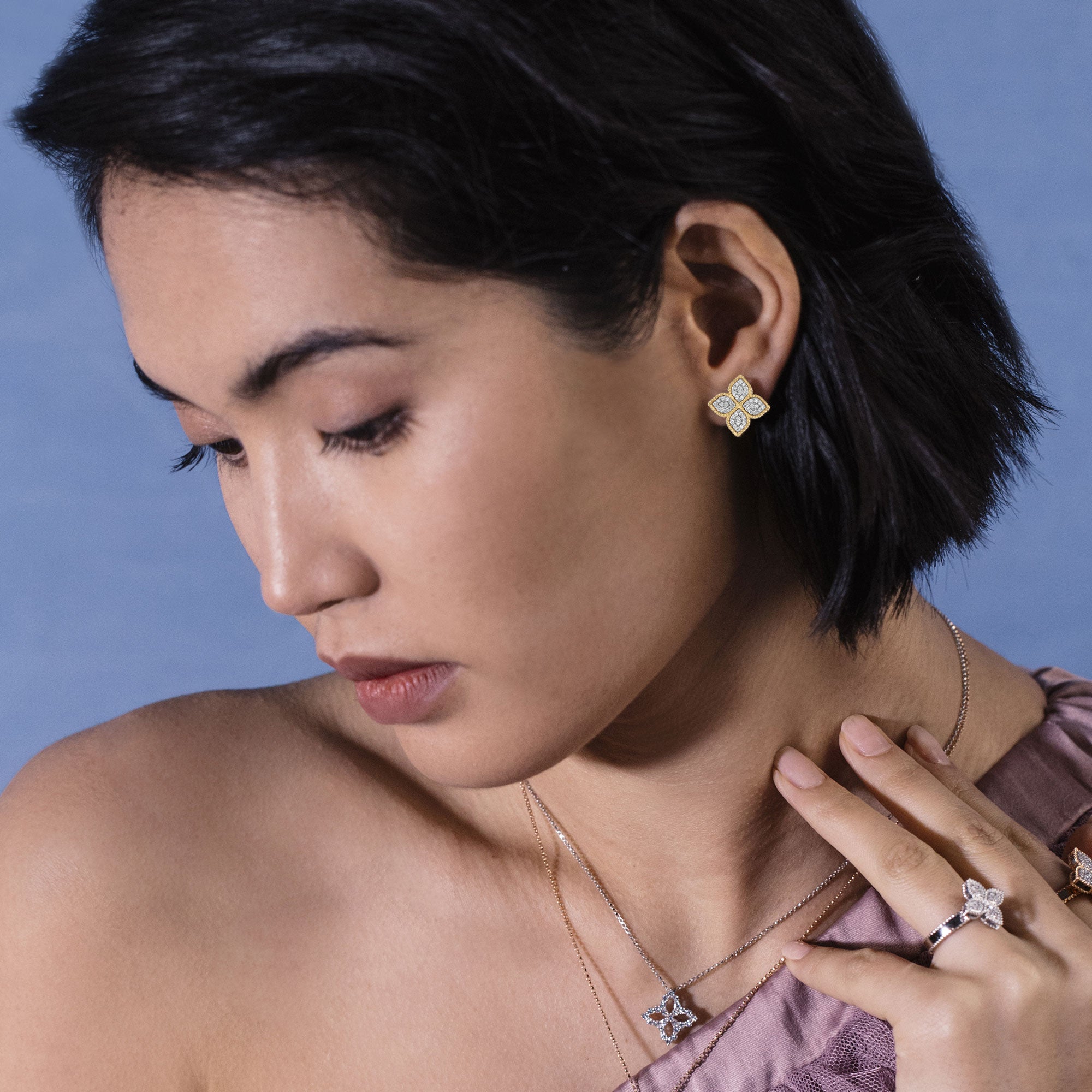 Roberto Coin Princess Flower 18ct rose and white gold diamond stud earrings featuring rope detail and hidden rubies.