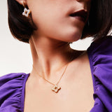 Roberto Coin Venetian Princess 18ct yellow gold necklet featuring open flower pendant with diamond clusters in each petal, rope detail, 45cm chain, and signature ruby clasp.