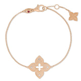 Roberto Coin Venetian Princess 18ct rose gold diamond bracelet featuring matte flower motif with rope detail, diamond-set petals, hanging flower drop, and signature ruby clasp.