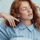 Roberto Coin Venetian Princess ring in 18ct rose gold featuring rhodonite-set flower petals, reversible diamond-set matte petals, and a signature hidden ruby inside the shank.
