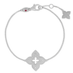 Roberto Coin Venetian Princess 18ct white gold diamond bracelet featuring matte open flower design, rope detail, hanging flower drop, and signature ruby clasp.