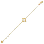 Roberto Coin Venetian Princess 18ct yellow gold diamond bracelet featuring matte open flower motif with rope detail, hanging flower drop, and signature ruby clasp.