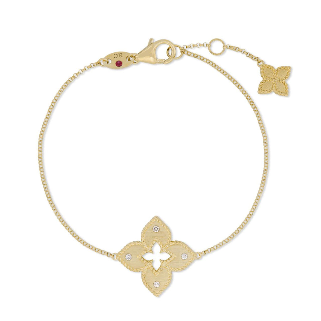 Roberto Coin Venetian Princess 18ct yellow gold diamond bracelet featuring matte open flower motif with rope detail, hanging flower drop, and signature ruby clasp.