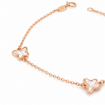 Rose gold trace link bracelet with three mother of pearl butterfly motifs.