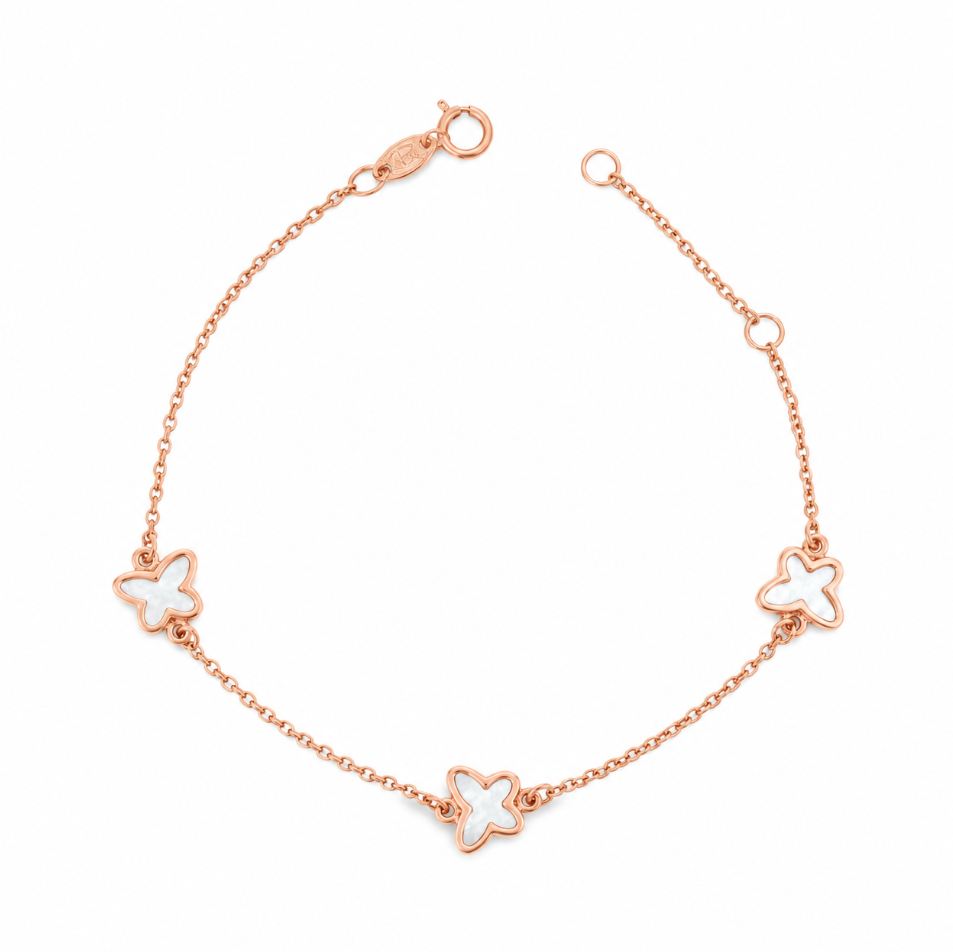 Rose gold trace link bracelet with three mother of pearl butterfly motifs.