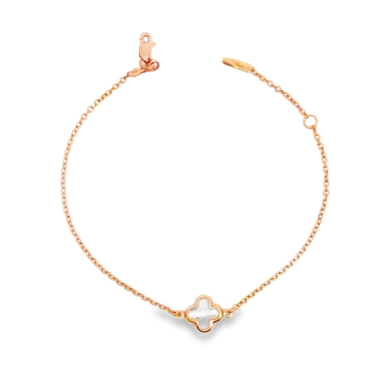 9ct rose gold trace link bracelet with mother of pearl clover centre.