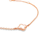 9ct rose gold trace link bracelet with mother of pearl clover centre.