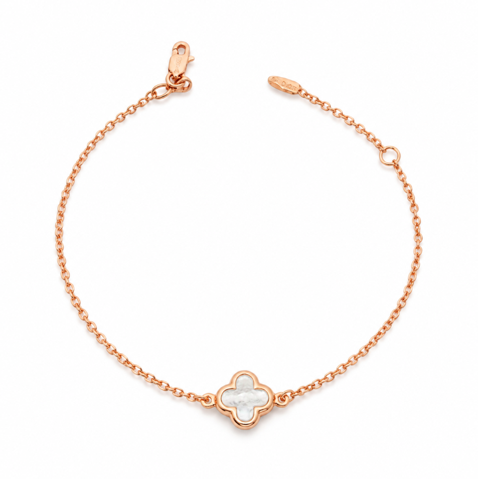 9ct rose gold trace link bracelet with mother of pearl clover centre.