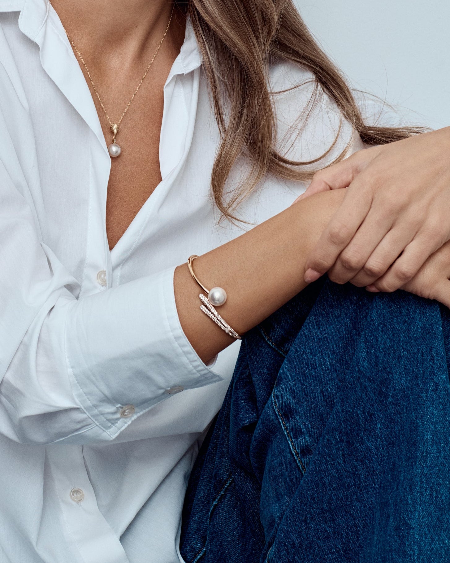 18ct rose gold South Sea pearl and diamond bangle with sweeping diamond-set curves.