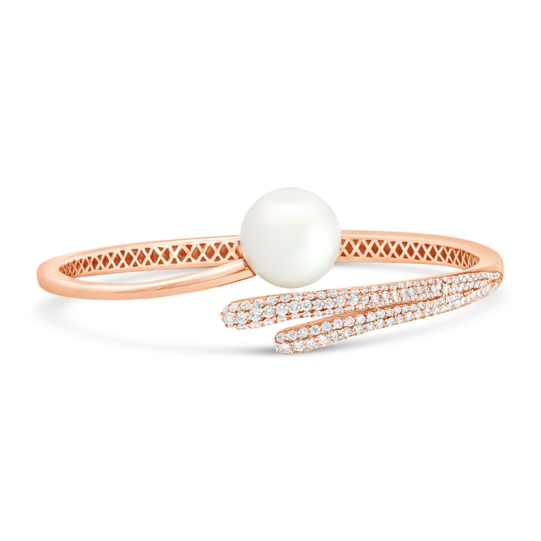 18ct rose gold South Sea pearl and diamond bangle with sweeping diamond-set curves.