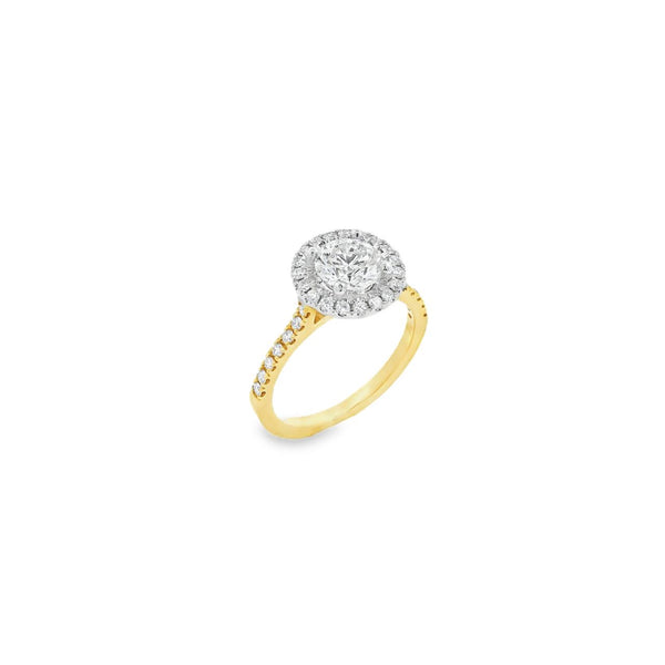 18ct yellow and white gold diamond halo ring featuring a 1.02ct round brilliant cut diamond with a multi-claw halo and diamond-set shoulders.