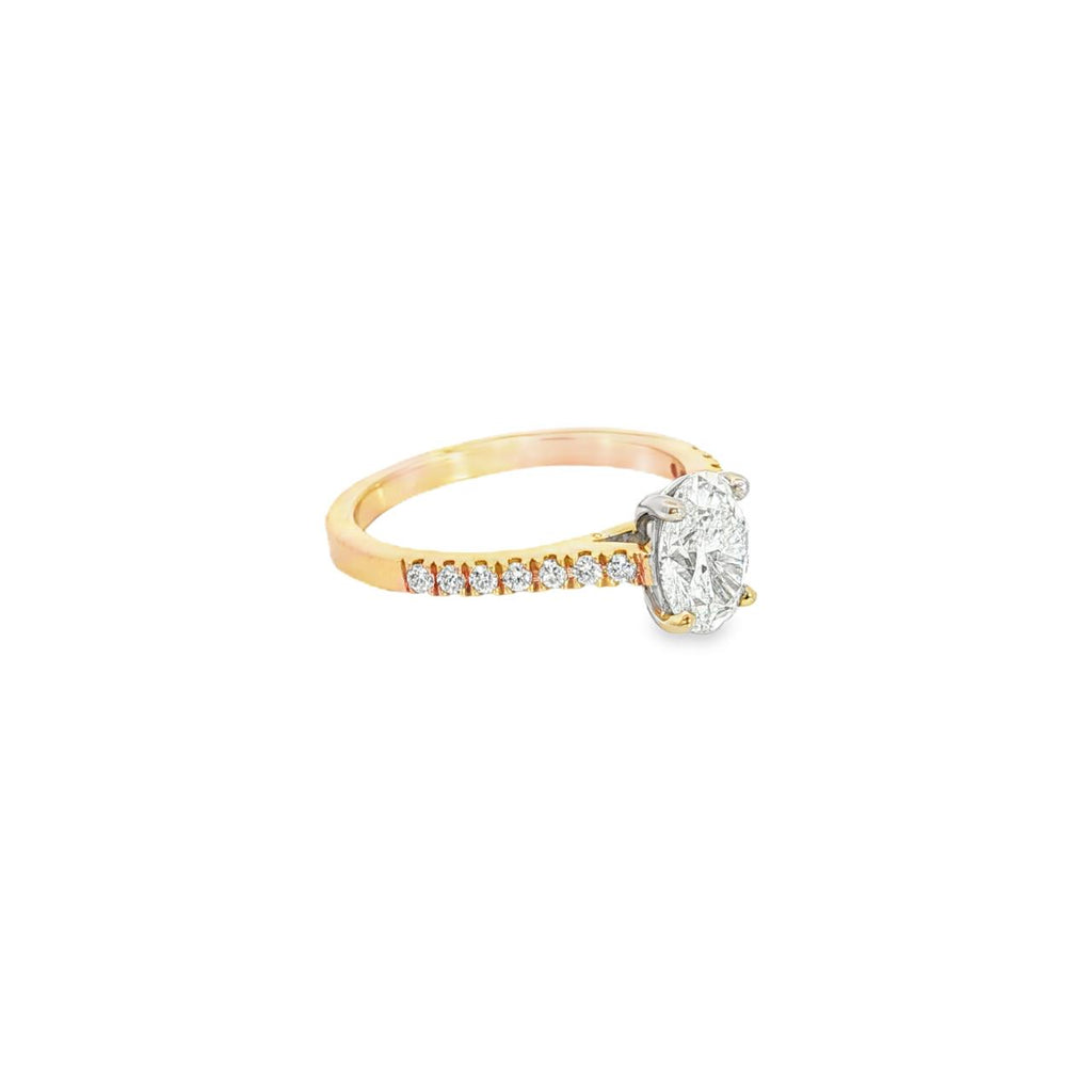 18ct rose and white gold diamond ring featuring a 1.02ct round brilliant cut centre diamond with diamond-set shoulders.