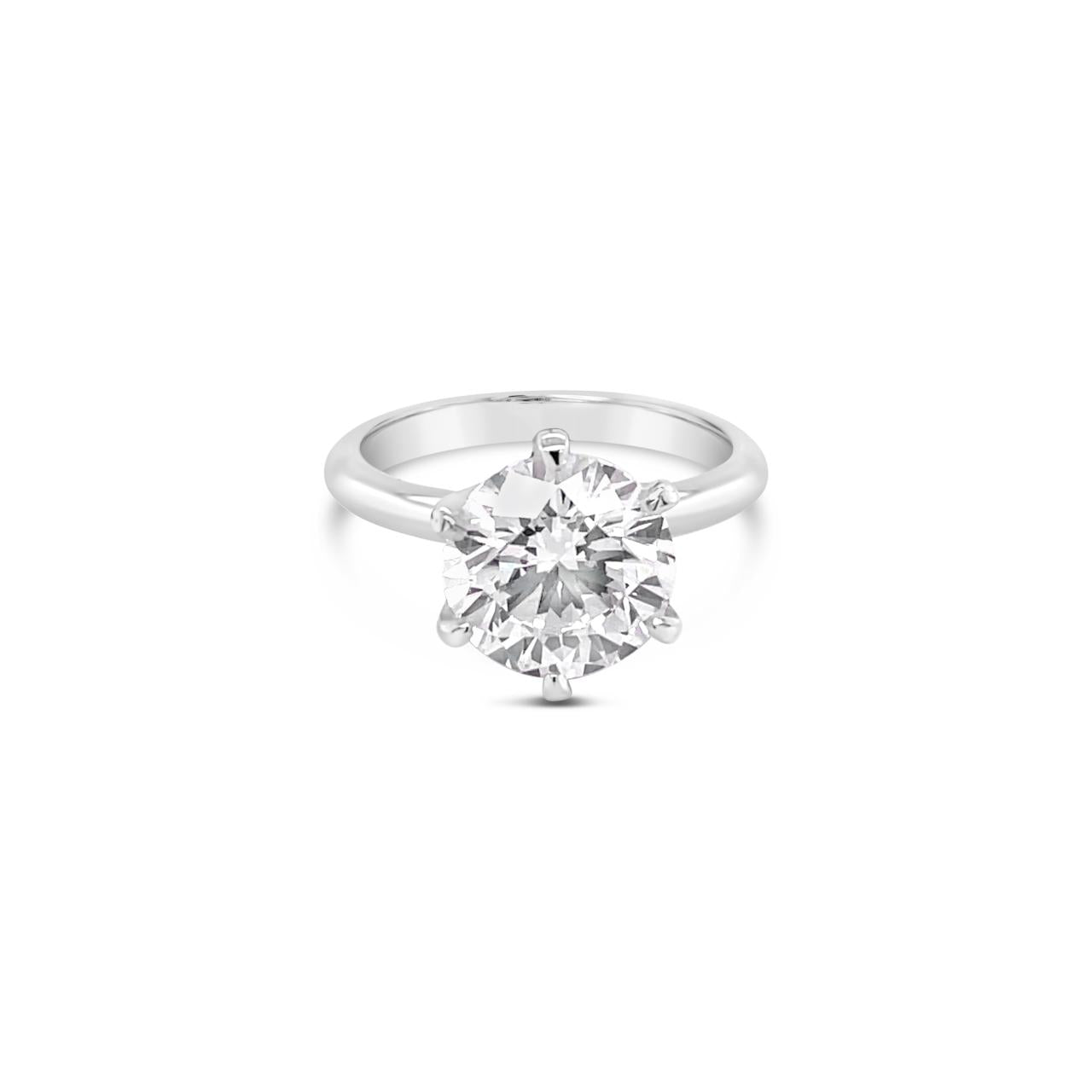 Platinum solitaire diamond ring featuring a 3.01ct round brilliant cut diamond in a six-claw setting.