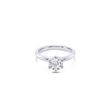 Platinum solitaire diamond ring featuring a 1.06ct round brilliant cut diamond in a six-claw setting.