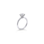 Platinum solitaire diamond ring featuring a 1.06ct round brilliant cut diamond in a six-claw setting.