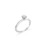 Platinum six-claw solitaire diamond ring featuring a 0.31ct round brilliant cut diamond with a coronet-style cut-out collet.