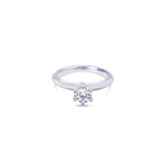 Platinum round brilliant cut 0.50ct solitaire diamond ring with six-claw setting and knife-edge shoulders.