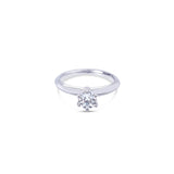 Platinum round brilliant cut 0.50ct solitaire diamond ring with six-claw setting and knife-edge shoulders.