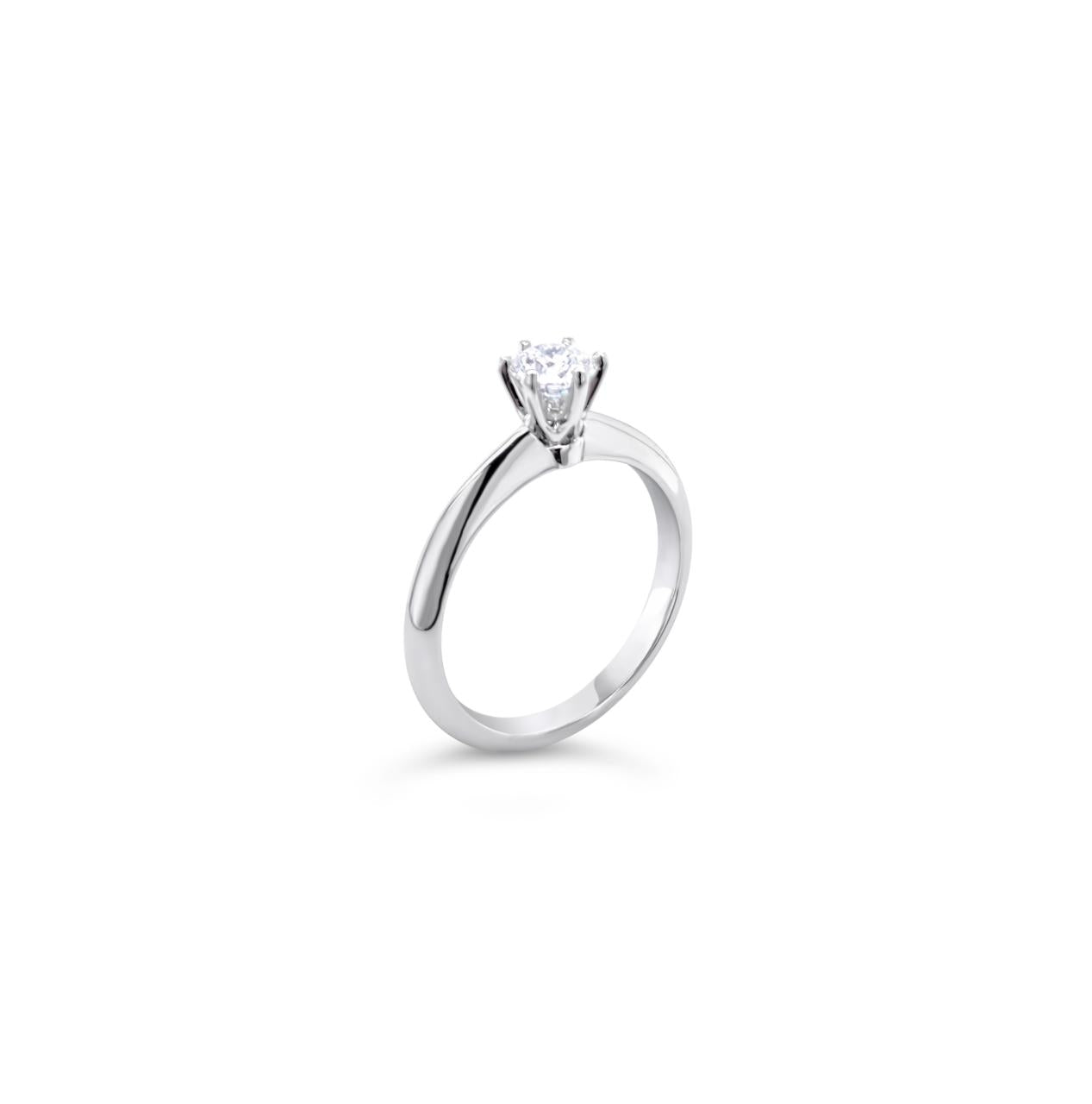 Platinum round brilliant cut 0.50ct solitaire diamond ring with six-claw setting and knife-edge shoulders.