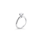 Platinum round brilliant cut 0.50ct solitaire diamond ring with six-claw setting and knife-edge shoulders.
