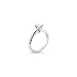 Platinum round brilliant cut 0.50ct solitaire diamond ring with six-claw setting and knife-edge shoulders.