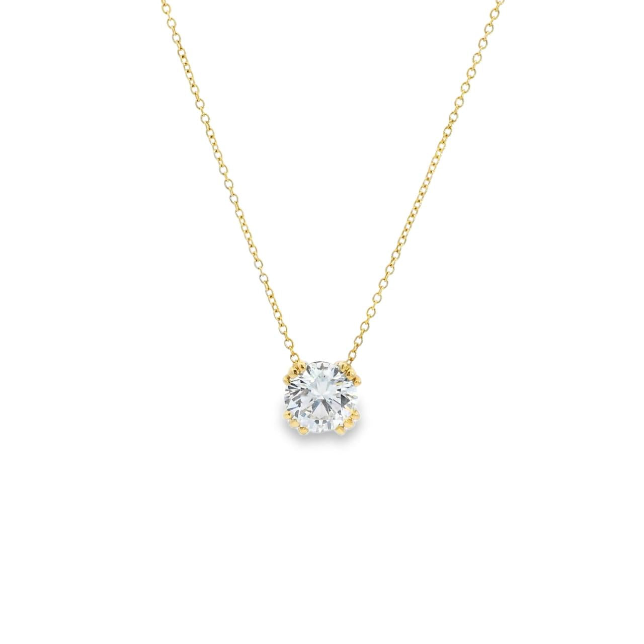 18ct yellow and white gold pendant featuring a 3.06ct round brilliant cut diamond in a four triple claw setting with concealed pendant runner on a 40cm fine trace link chain.