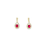 18ct yellow gold earrings featuring oval rubies in three-claw settings with a pear-shaped diamond halo cluster, totalling 0.71ct rubies and 0.44ct diamonds.