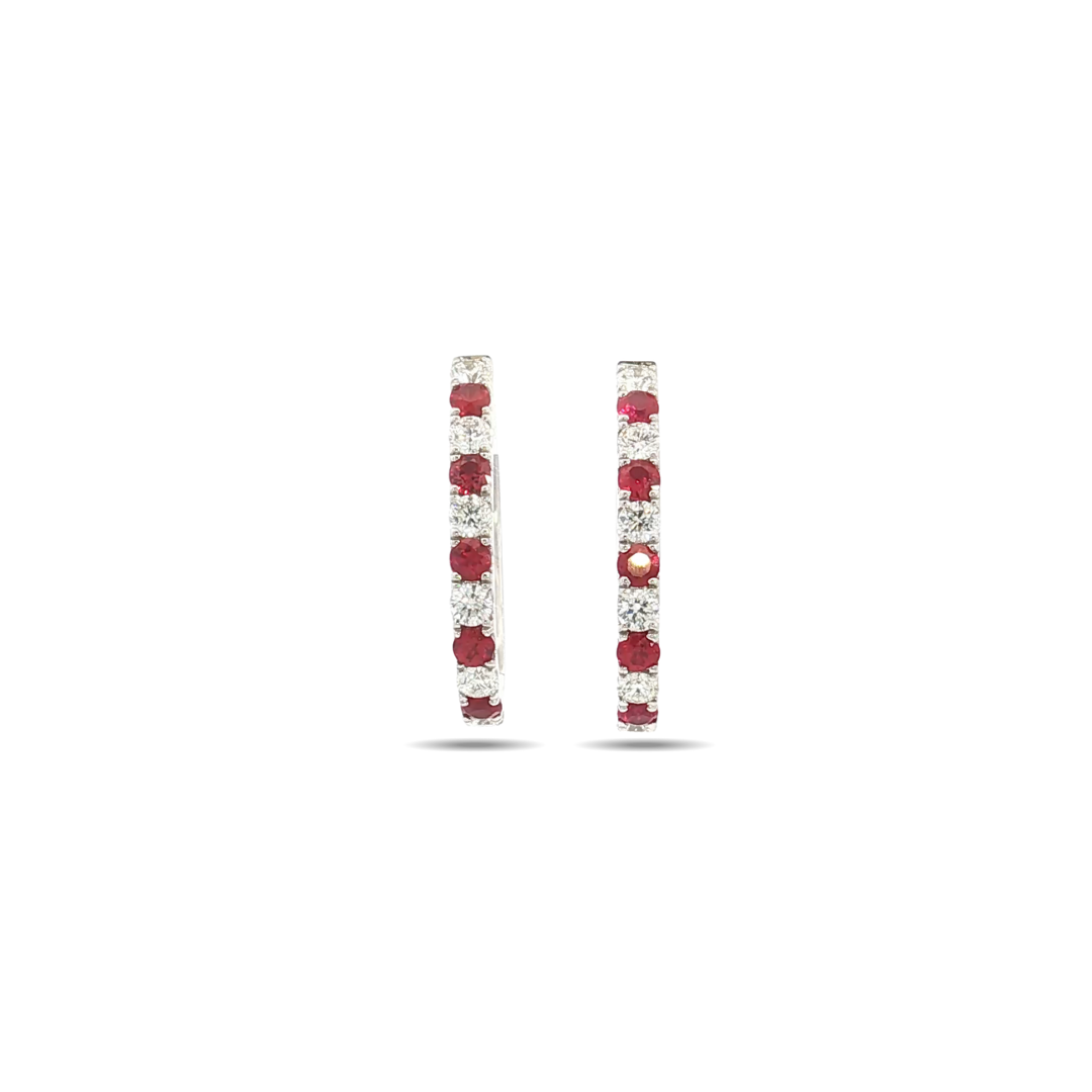 18ct white gold hinged earrings featuring alternating rubies and round brilliant cut diamonds in claw settings.