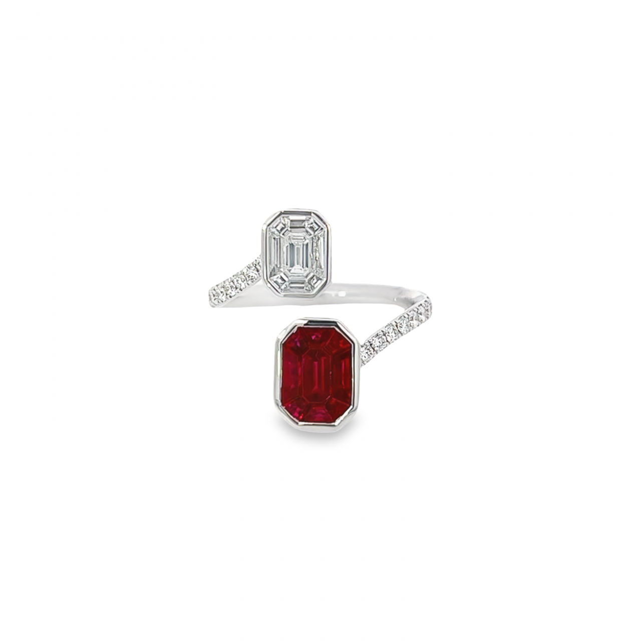 18ct white gold ruby and diamond crossover ring featuring octagonal invisible cluster settings with baguette, emerald, and trapezoid cut stones.
