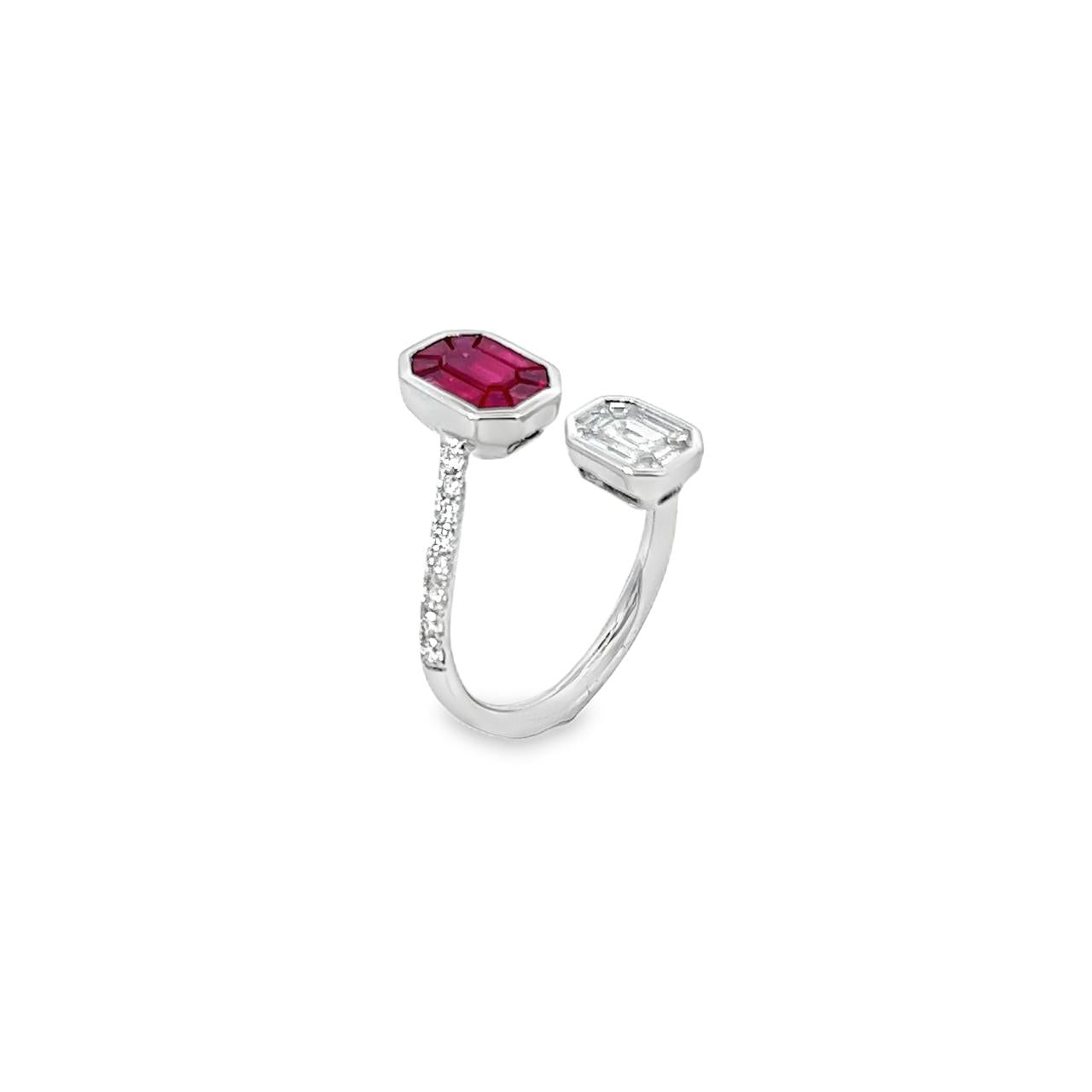 18ct white gold ruby and diamond crossover ring featuring octagonal invisible cluster settings with baguette, emerald, and trapezoid cut stones.