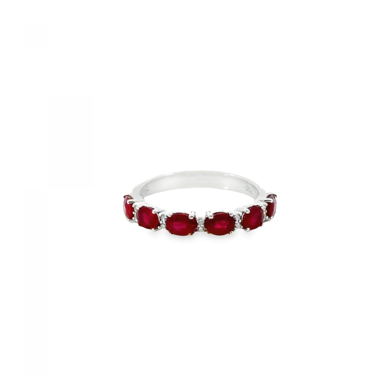 18ct white gold ring featuring six oval-cut rubies and ten round brilliant cut diamonds in alternating horizontal claw settings across the top.