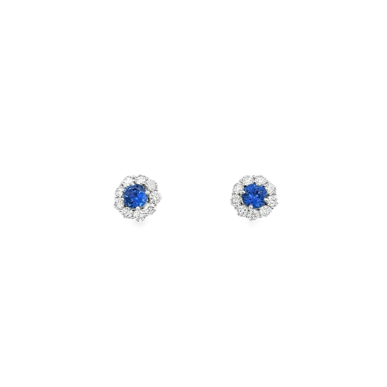 18ct white gold sapphire and diamond stud earrings featuring round centre sapphires surrounded by diamond halos, with post and butterfly fittings.