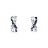 18ct white gold sapphire and diamond earrings featuring a curved “X”-shaped crossover front with alternating sapphire and diamond rows.