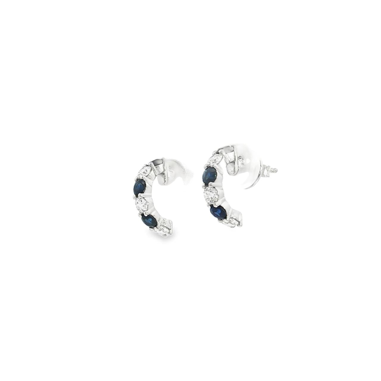 18ct white gold curved bar earrings featuring alternating claw-set sapphires and diamonds, with post and butterfly fittings.