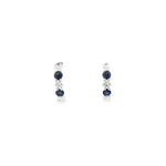 18ct white gold curved bar earrings featuring alternating claw-set sapphires and diamonds, with post and butterfly fittings.
