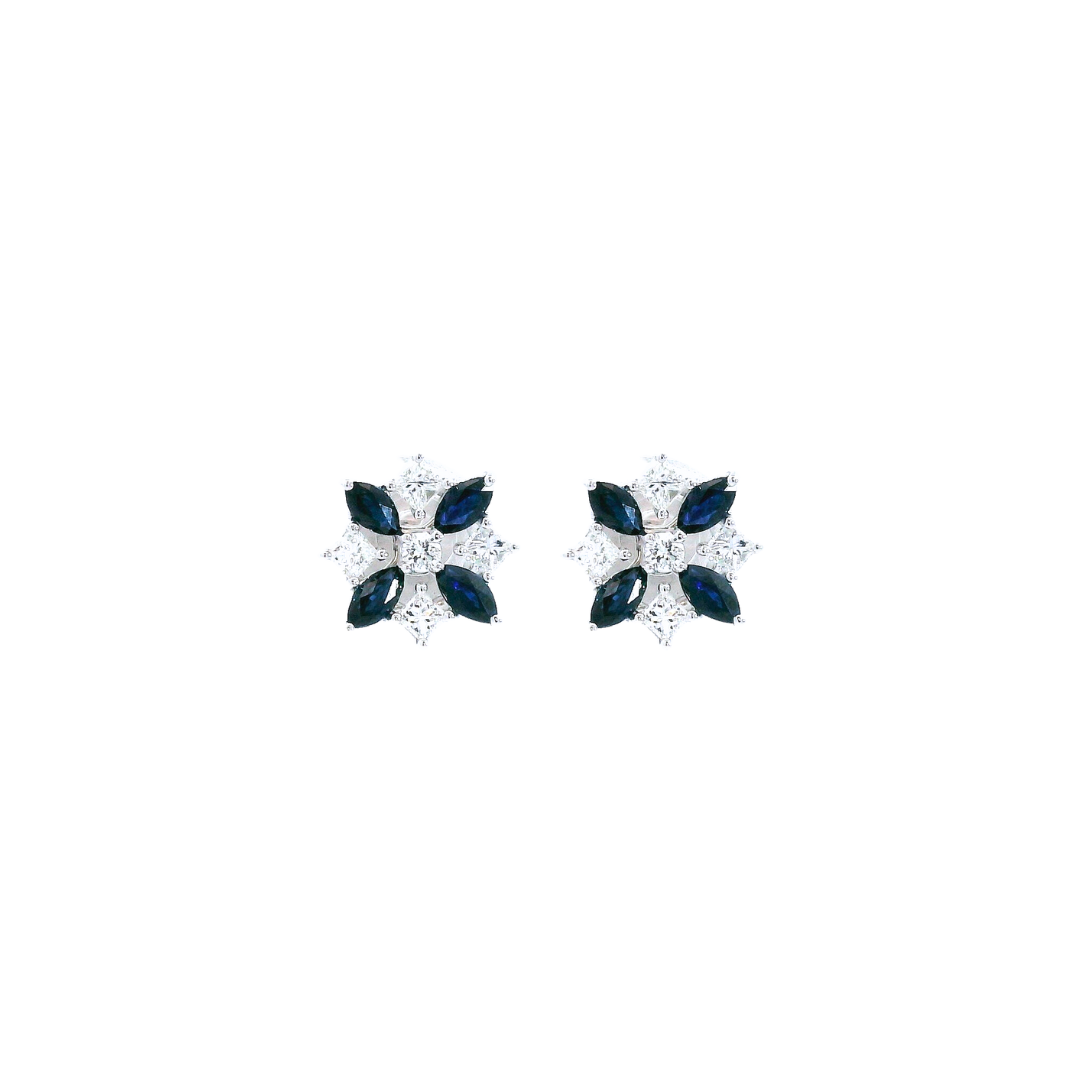 18ct white gold stud earrings in a floral design with marquise-cut sapphires and round brilliant-cut diamonds, post and butterfly fittings.