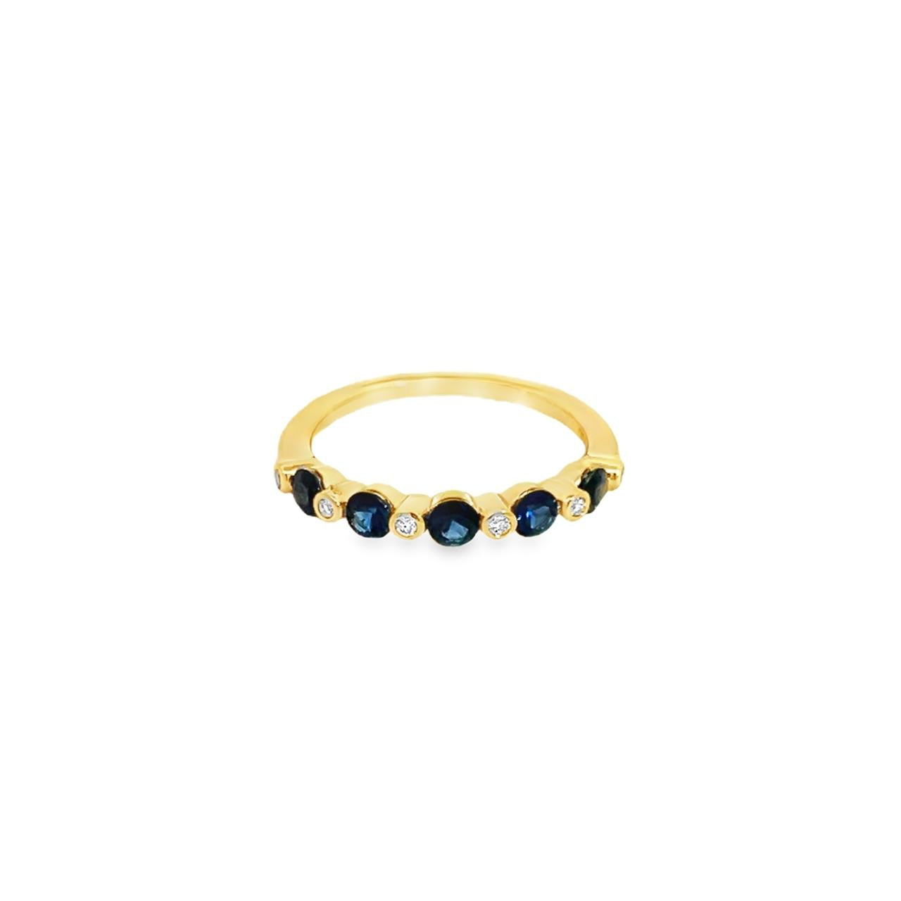 18ct yellow gold ring featuring five Australian sapphires and six round brilliant cut diamonds in alternating cut-out and bezel settings across the top.
