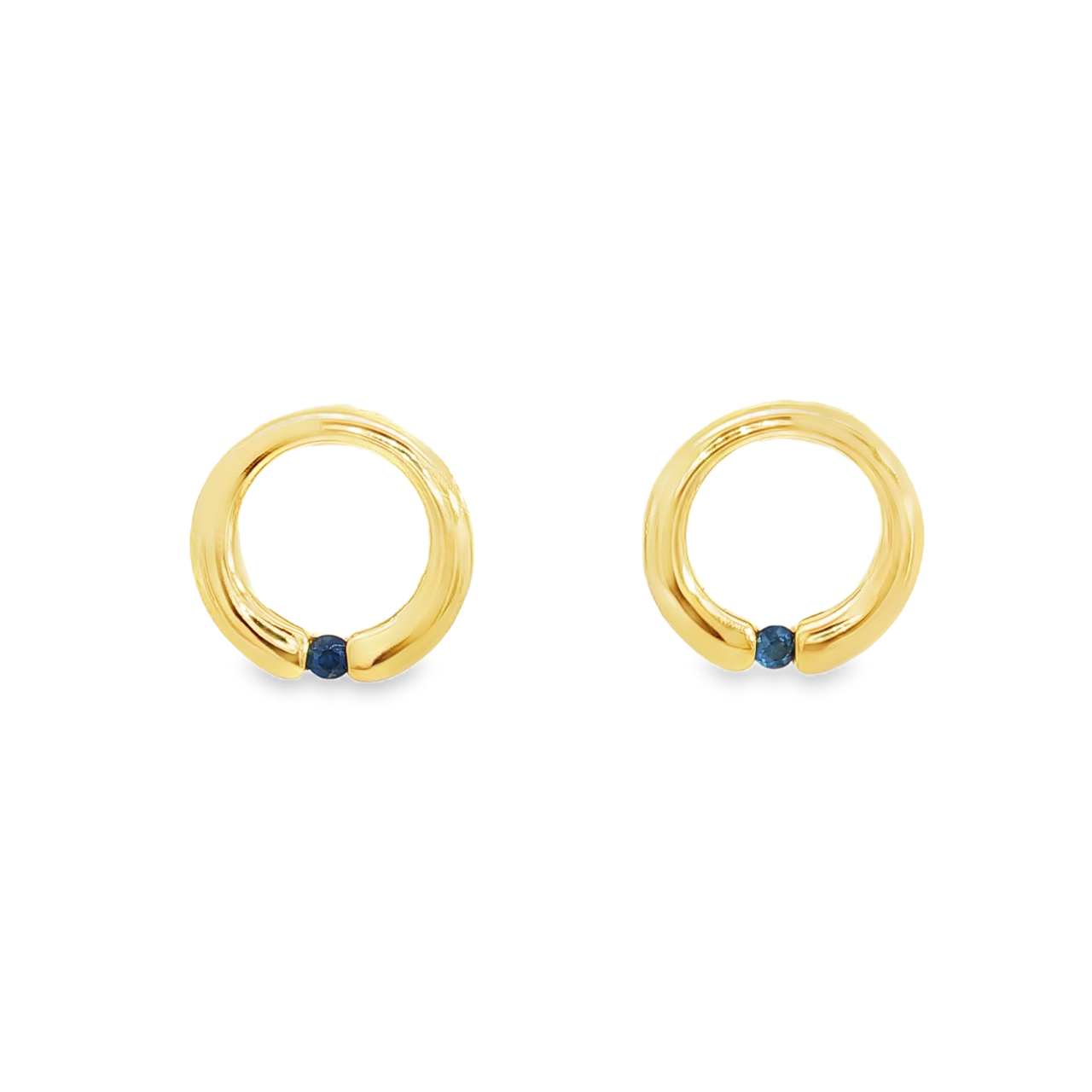 9ct yellow gold sapphire open circle stud earrings featuring a single blue sapphire set at the base of each earring.