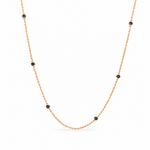 18ct yellow gold sapphire station necklet featuring seven round-cut blue sapphires in individual bezel settings along a fine 42cm trace chain.