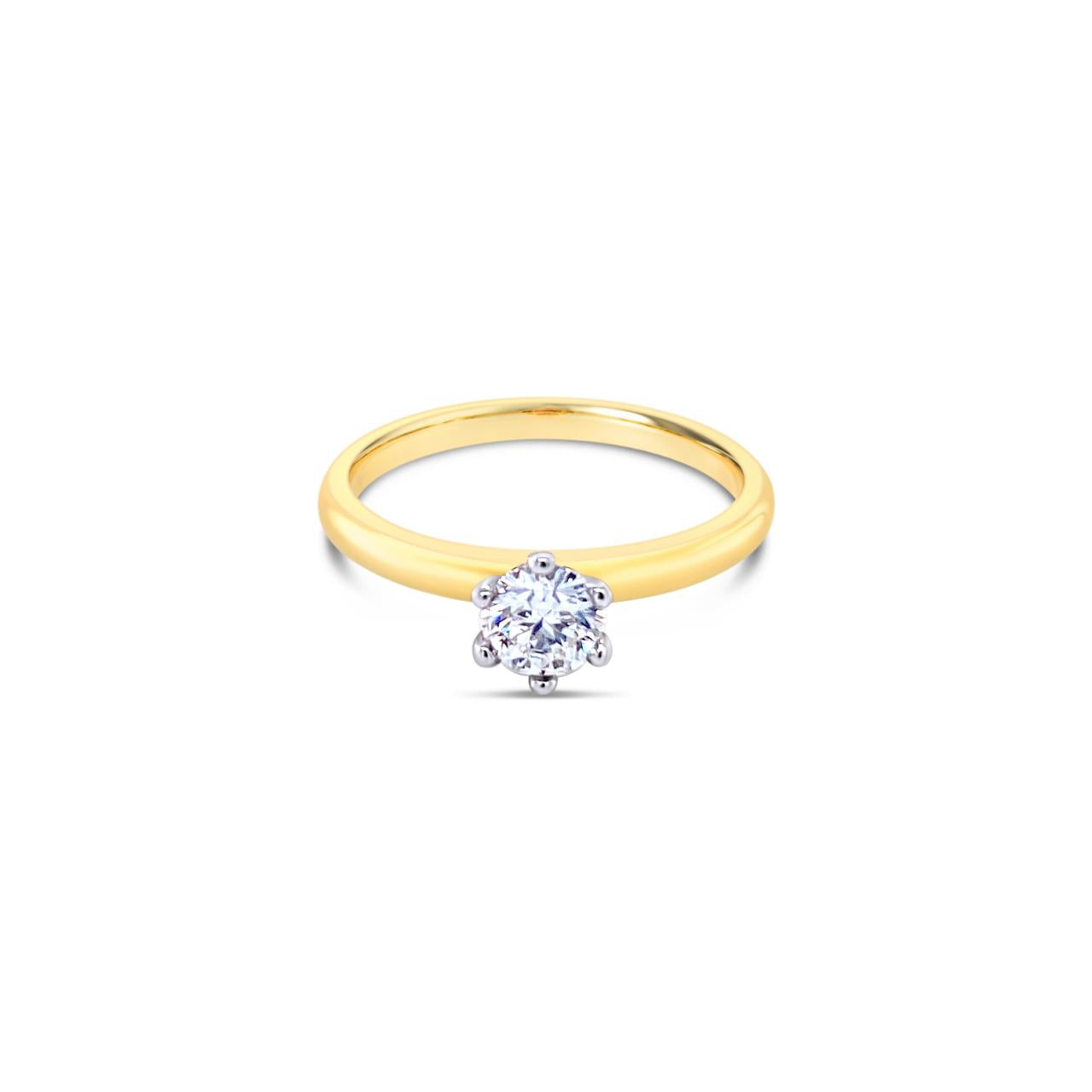 18ct yellow and white gold solitaire ring featuring a 0.40ct F/SI1 round brilliant cut diamond in a six-claw setting.