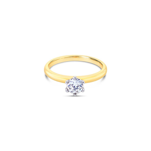 18ct yellow and white gold solitaire ring featuring a 0.40ct F/SI1 round brilliant cut diamond in a six-claw setting.