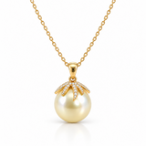18ct yellow gold South Sea pearl and diamond pendant featuring a 14mm light golden pearl with a sculptural pavé diamond-set cap.
