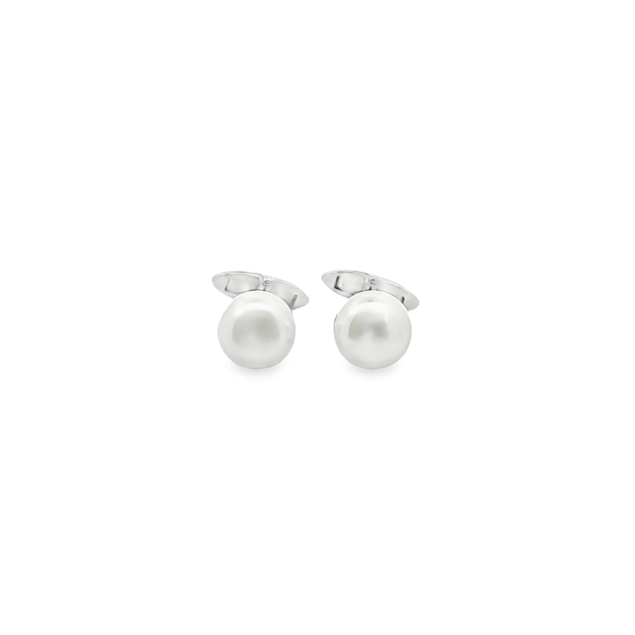Sterling silver cufflinks with 11mm white South Sea pearls in cup settings.