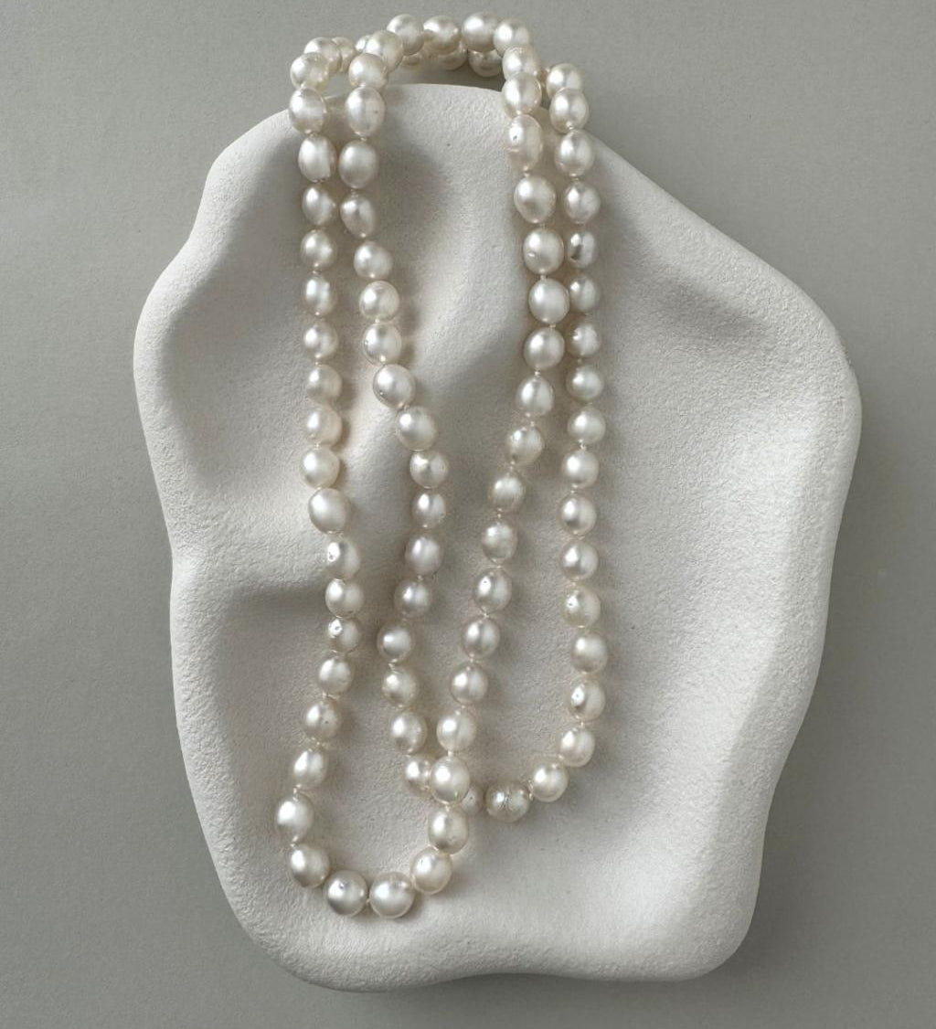 long South Sea pearl strand necklace with silver white oval pearls and sterling silver clasp
