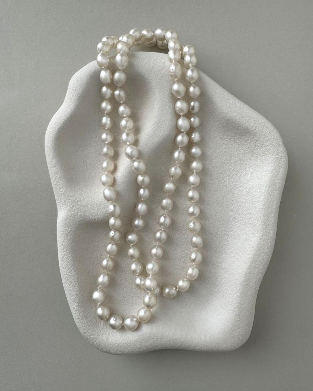 long South Sea pearl strand necklace with silver white oval pearls and sterling silver clasp