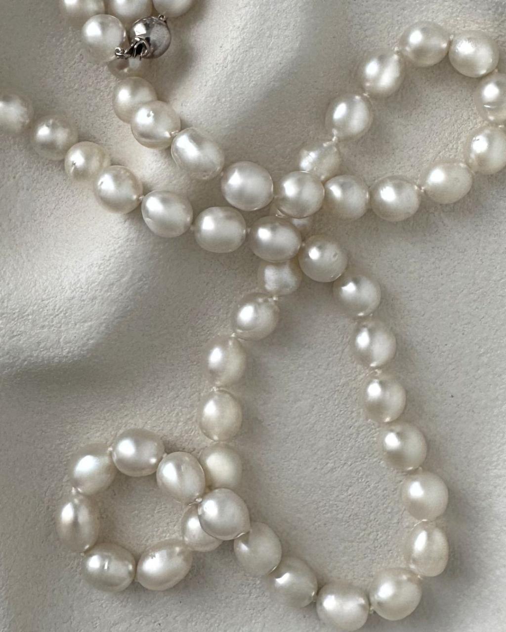 long South Sea pearl strand necklace with silver white oval pearls and sterling silver clasp